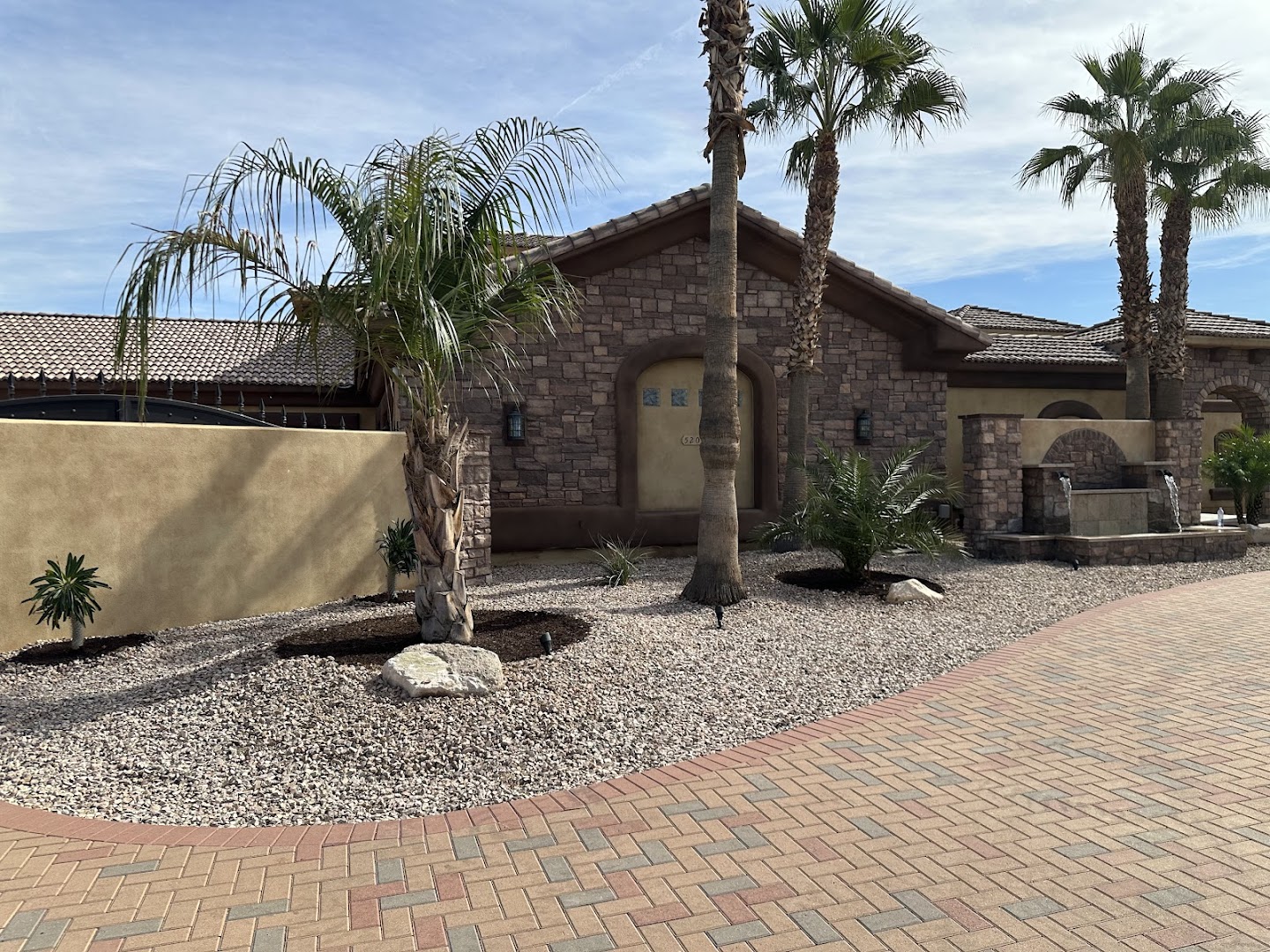 Desert front yard with palms and pavers, Glendale AZ