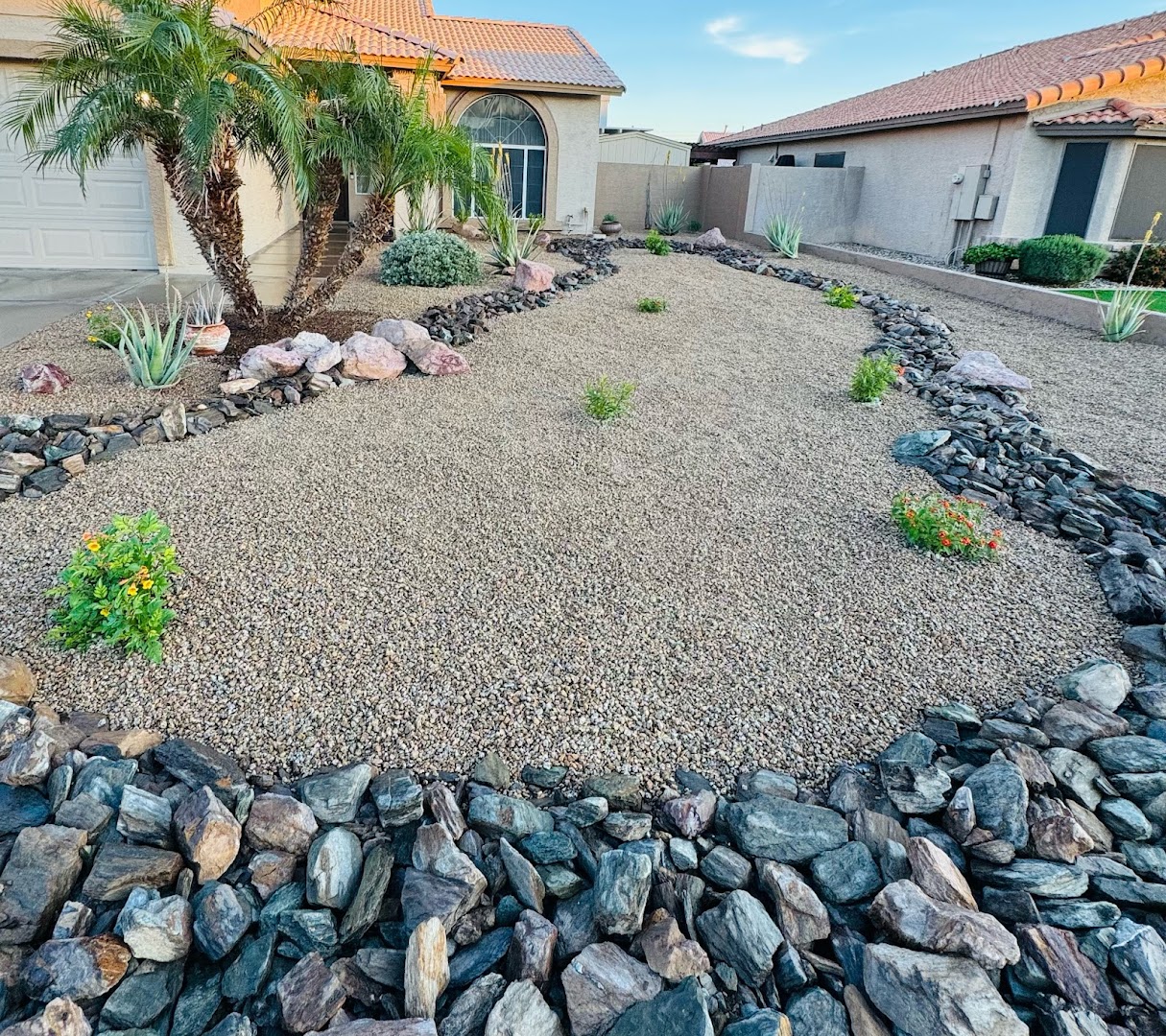 River rock desert landscaping with plants, Glendale AZ